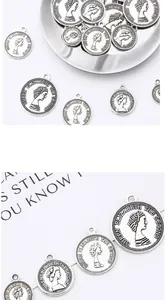 Detailed macro view of vintage silver coin alloy pendants for DIY jewelry making