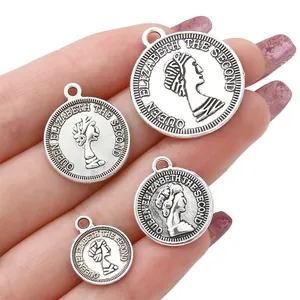 Set of four vintage silver alloy coin pendants with relief of Queen Elizabeth II for DIY jewelry