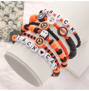 Detail of Halloween DIY bracelet set with clay beads, charms and holiday letter beads