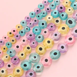 Macro view of colorful flat round evil eye glass beads for DIY jewelry making crafts