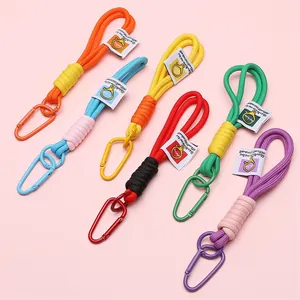 Detail of colorful braided nylon keychains with alloy carabiners and text labels