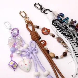 Colorful alloy figure-8 spring buckles with leather tassels and beaded charms for DIY keychains