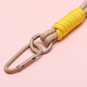 Handmade bicolor braided nylon keychain featuring a stylish beige metal lobster clasp hook