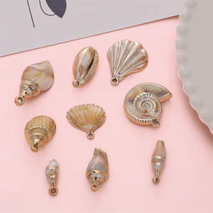 Set mit 9 Acrylmuschel-Anhängern mit Goldrand für DIY-Schmuck und Ohrringe
