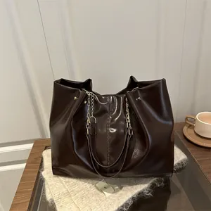 Large dark brown tote bag in glossy soft leather with dual handles and gold chain detail