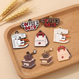 Macro shot of coffee-themed enamel charms in a wooden tray with refined vintage details