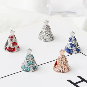 Macro detail of alloy Christmas tree charms with colorful rhinestones for DIY bracelets