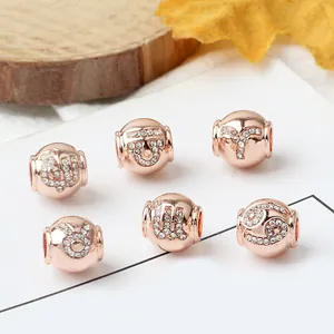 Cuentas de signos del zodiaco en oro rosa con cristales para pulseras DIY elegantes