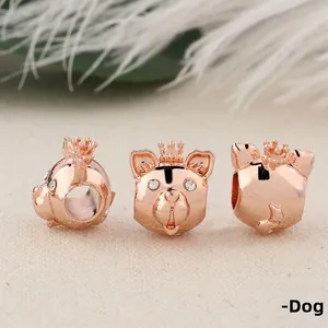 Macro shot of rose gold puppy bead with crown and rhinestones from multiple angles