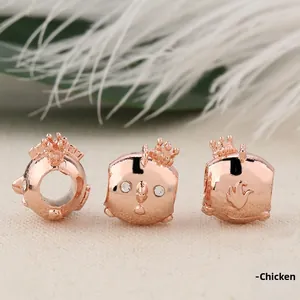 Detail of rose gold chicken charm with crown and crystals for DIY beaded bracelets