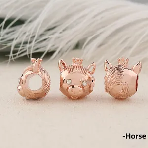 Detailed macro view of rose gold horse charm with crown and sparkling crystal eyes
