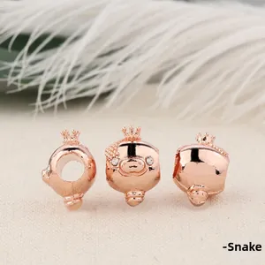 Rose gold crown pig charm bead for bracelets with sparkling rhinestones and a snake motif