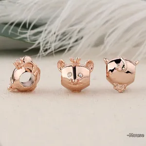 Macro detail of rose gold crown mouse beads with inlaid white crystals for bracelets
