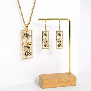 Parure de bijoux hawaïenne avec tortue, frangipanier et incrustations d'abalone