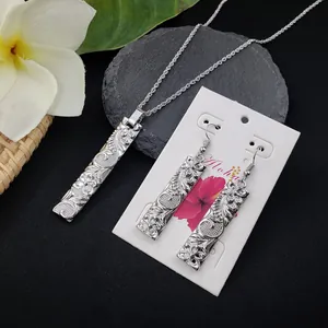 Silver bamboo bar jewelry set with Hawaiian floral engravings and tropical decor