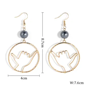 Hawaiian Shaka hand gesture drop earrings with dark grey pearl and gold plating