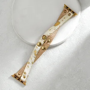 Slim Apple Watch strap with white cowhide leather and gold-tone metallic animal print