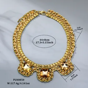 Detail of chunky gold chain necklace with amber crystals and measurement labels