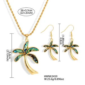 Macro detail of palm tree jewelry set with colorful abalone shell and gold plating