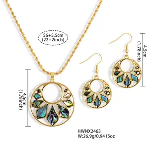 Macro shot of gold plated sunflower jewelry set with colorful abalone shell inlay