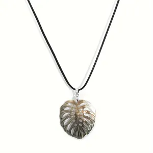 Hawaiian turtle leaf shell pendant necklace with black cord and iridescent finish