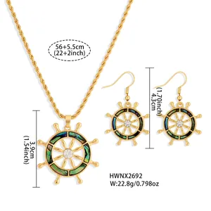 Detail shot of gold sunflower jewelry set with colorful abalone shell inlay