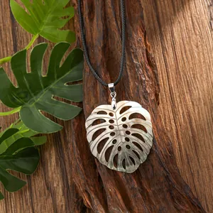 Detailed macro of turtle leaf pendant in natural shell with iridescent pearly luster