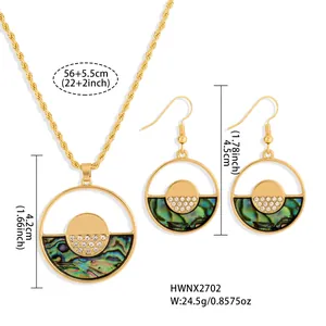 Detailed view of sunflower jewelry set with abalone shell inlays and white rhinestones