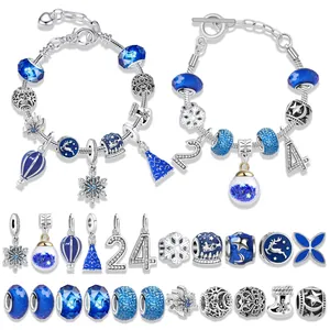 Blue winter themed DIY charm bracelet set with snowflake and reindeer beads in a gift box