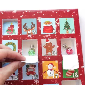 Red Christmas advent calendar box with 24 windows and DIY snowman bracelet charms