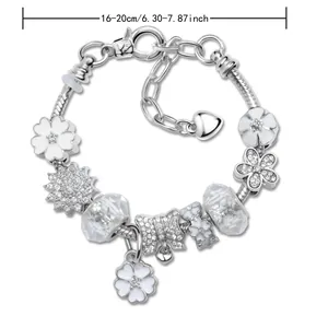 Blauwe bloem DIY bedelarmband met vlinder en hart bedels op zilveren slangenketting