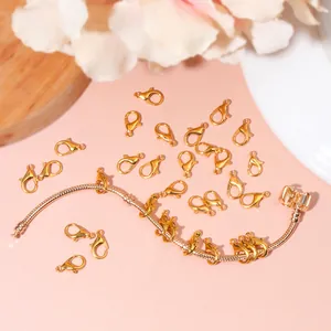 Detailed view of gold lobster clasps and snake chain for creative DIY jewelry making