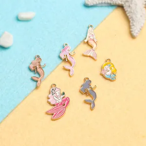 Detail of six colorful alloy mermaid charms with drip oil craft for DIY jewelry making