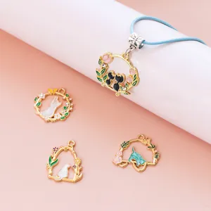 Detail of alloy cat and floral enamel charms for DIY jewelry making accessories