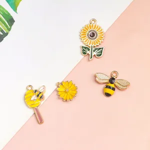 Enamel bee and sunflower charms in gold alloy for DIY jewelry necklace making