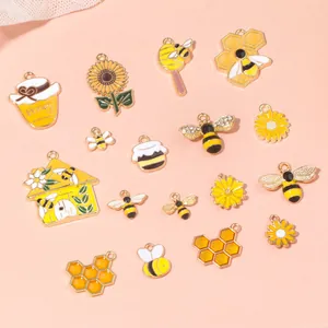 Detail of assorted honeybee and sunflower enamel charms for DIY jewelry making
