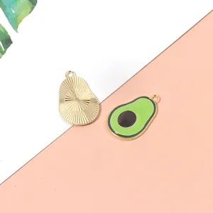 Green avocado enamel fruit pendant with golden core and textured metal back for jewelry DIY