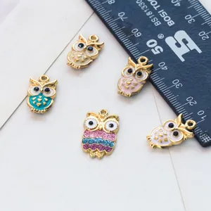 Cute enamel owl alloy charms for DIY jewelry making shown with a measurement scale