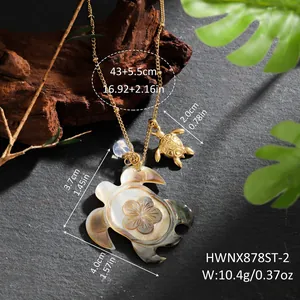 Macro detail of hawaiian sea turtle necklace with iridescent shell and floral engraving