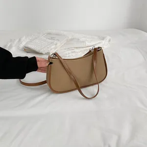 Retro canvas crescent underarm bag with brown leather trim and silver ring hardware