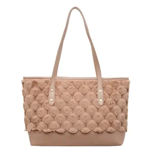Chic mauve contrast color bucket bag with plush textured panels and long top handles