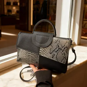 Women's 2025 fashion handbag featuring crocodile texture and metal handle with crossbody strap