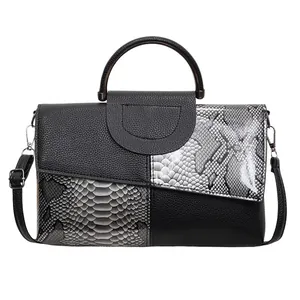 Fashionable women's tote bag with black litchi and white python pattern textures