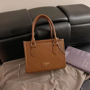 Brown checkered PU leather handbag with dual handles and silver chain shoulder strap