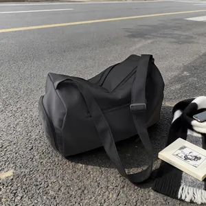 Sac de voyage minimaliste noir grande capacité pour le yoga le sport et les bagages