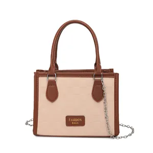 Minimalist beige and brown plaid patterned crossbody bag with metallic chain strap