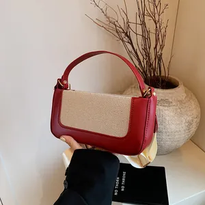Retro burgundy and beige woven fabric shoulder bag with wide strap and gold hardware