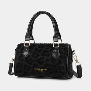 Retro leopard print Boston bag in black fabric with gold hardware and top handles