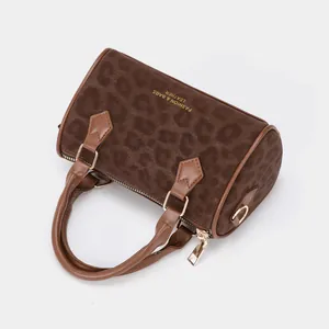 Vintage leopard print boston bag with gold lettering and brown top handles