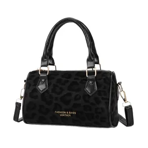 Fashionable black leopard pattern Boston bag with gold lettering and leather trim